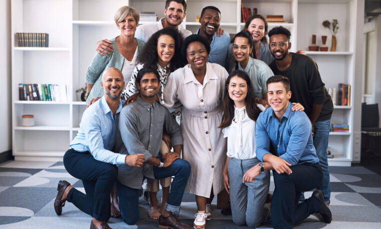Portrait of a diverse group of businesspeople standing together in an office.